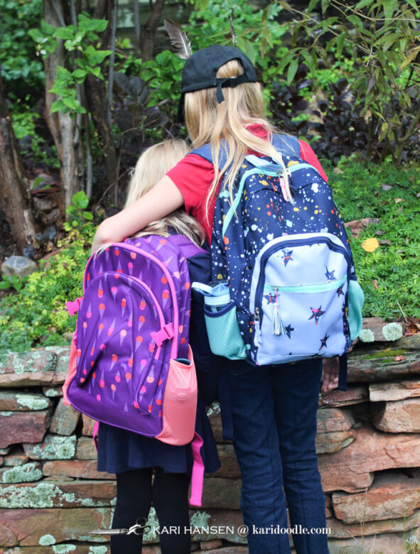 2 young girls with backpacks