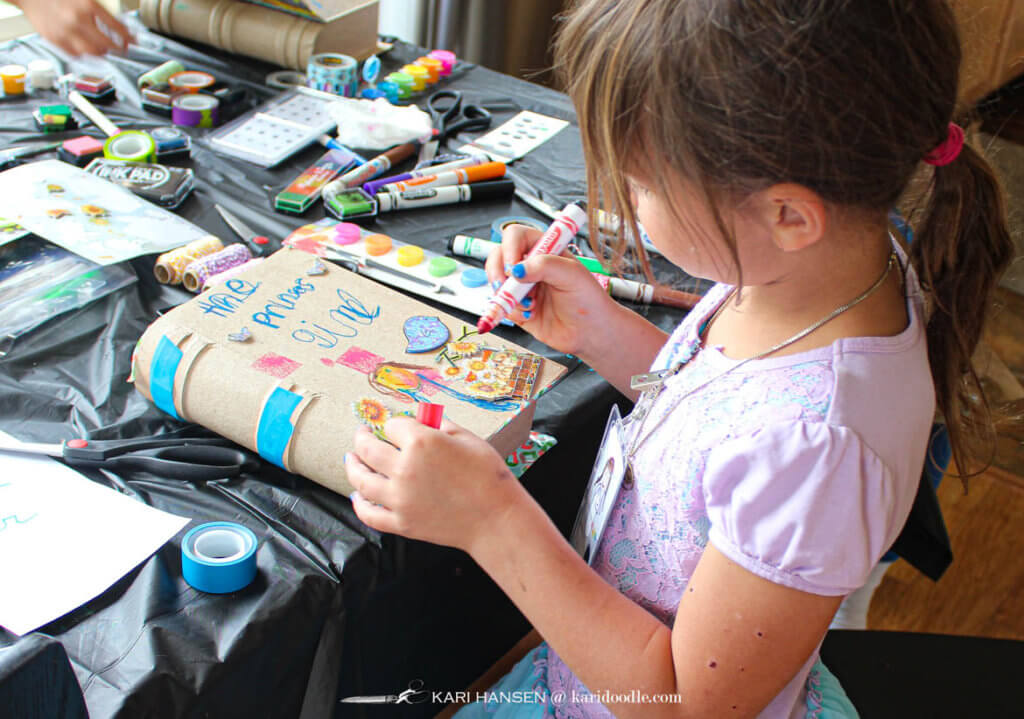 girl decorating book cover