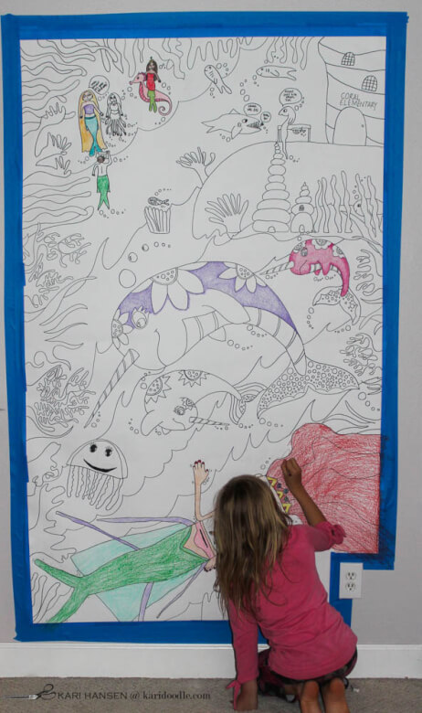 girl coloring huge paper mural