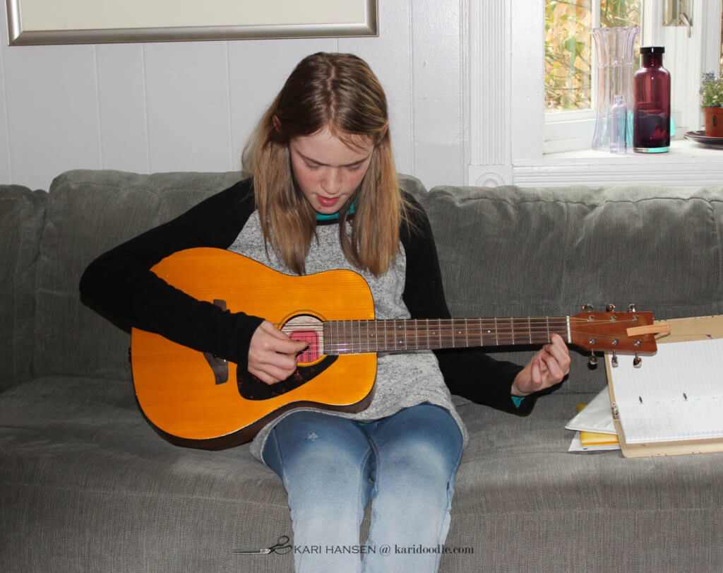 girl playing guitar