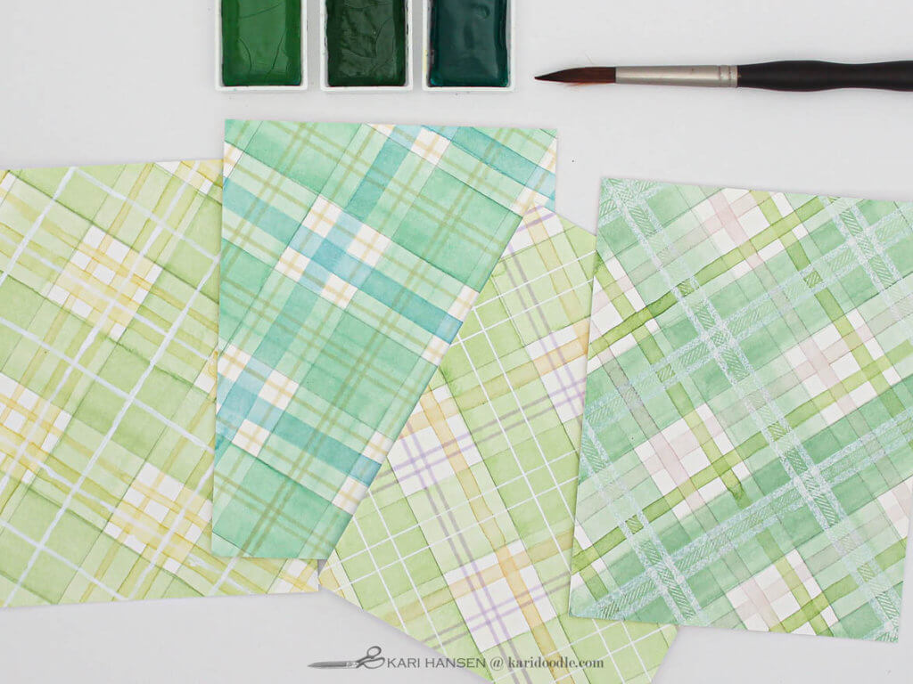 4 green watercolor tartan panels with paint and brush