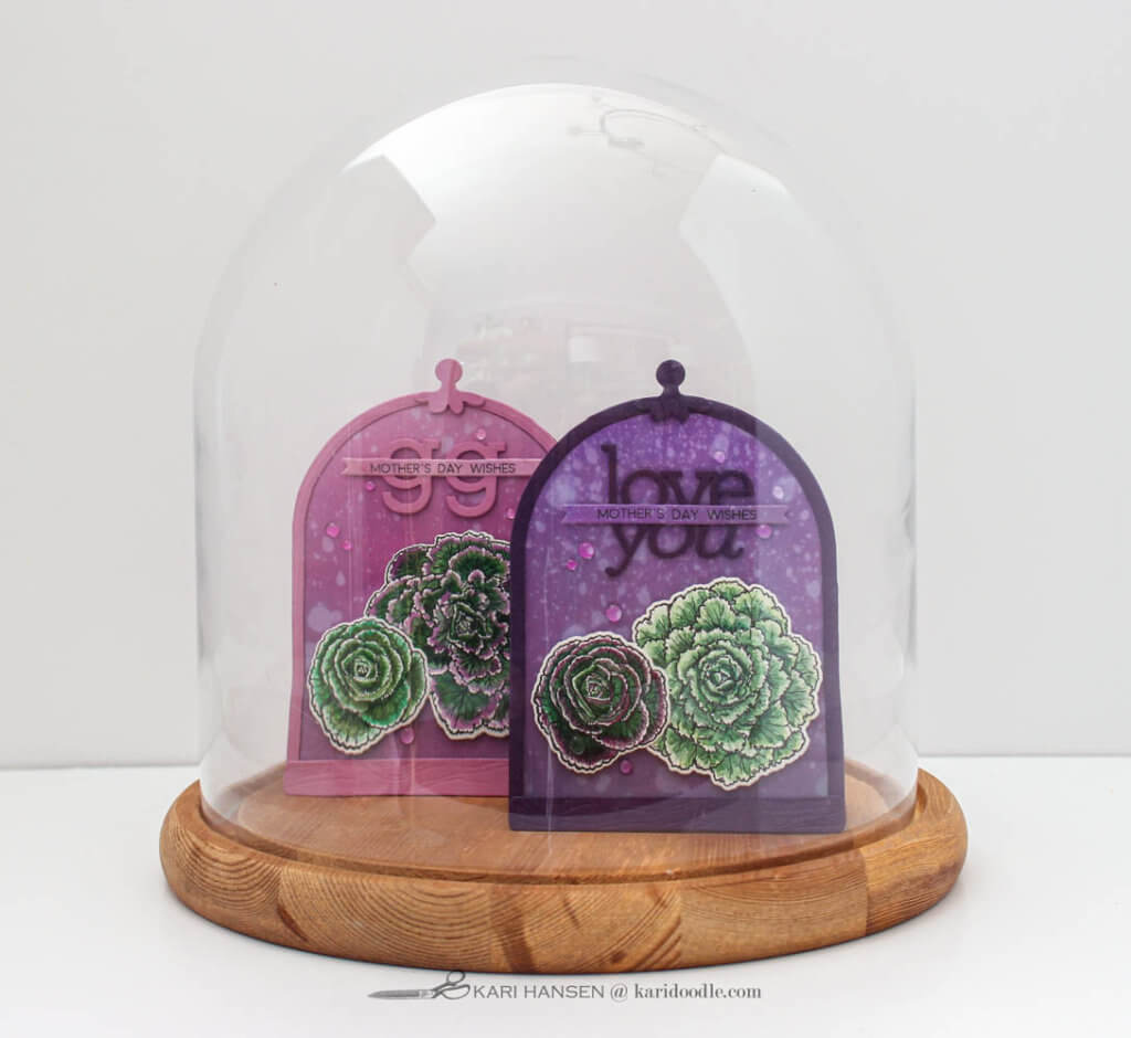 cloche shaped cards under glass dome