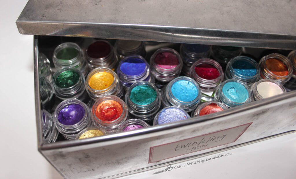 metallic watercolor pans in a tin